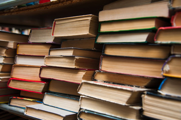 Old books on book shelf background