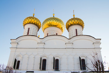 Golden domes church on a background of blue sky