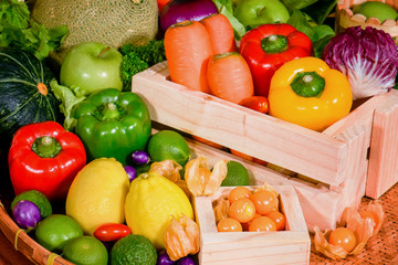 Various fresh fruits and vegetables in wooden container for eating healthy
