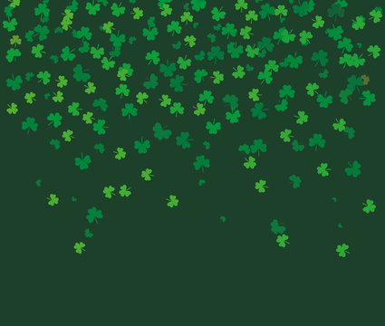Flying leaves of clover different shades of green on dark background. Pattern for St. Patrick's Day. Rectangular, horizontal backdrop. Vector illustration with copy space