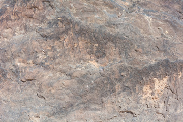 Textured surface of colorful rock