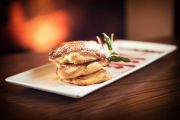 Fluffy Wholemeal Pancakes with sauce on a White Plate