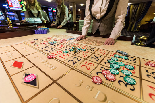 gambling chips on a game table roulette