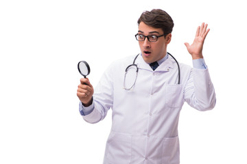 Doctor with magnifying glass on white background