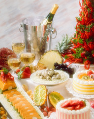 Soft focus photo of Buffet with Wine, prawns, lapwing eggs and desserts