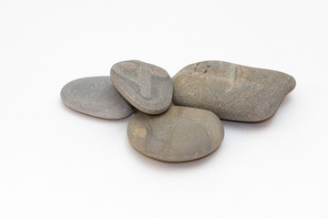Fototapeta na wymiar stones from the beach on a white background