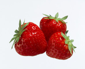 Three Strawberries on white background
