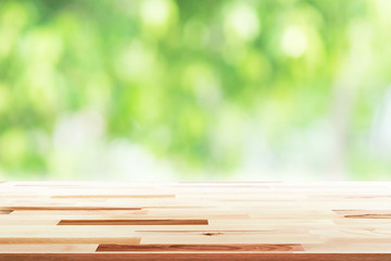 Empty wooden table with blurred city park on background. concept party, products, spring.