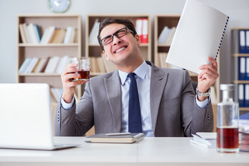 Businessman drinking in the office