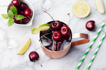 Cold cherry Moscow Mule cocktail Marble background