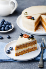 Vegan, raw carrot cake. Healthy food. Grey stone background