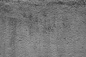 Wall fragment with scratches and cracks