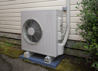 Air conditioning and heating unit for a private residence