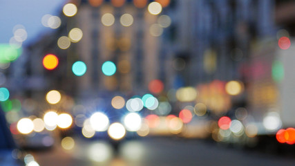 Night city lights and traffic. Out of focus background with blurry unfocused city lights and driving cars.