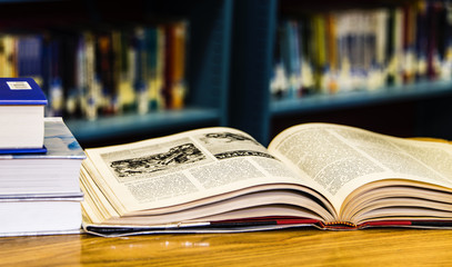 Old classic library with books on table