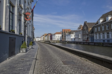 Fototapeta na wymiar Historical buildings on a canal in Bruges, Belgium