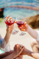 couple drink wine on beach