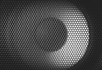 Detail shot of some round speakers. Speaker grill texture. Audio equipment.
