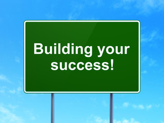 Finance concept: Building your Success! on road sign background