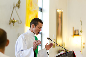 Indoors portrait of a young caucasian priest