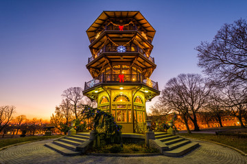 Christmas decorations on the Patterson Park Pagoda at sunset, in Baltimore, Maryland. - obrazy, fototapety, plakaty