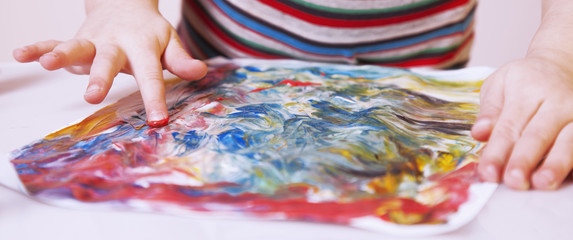 beautiful little baby girl draws a picture paints (postmodernism, talent, creativity, creativity)