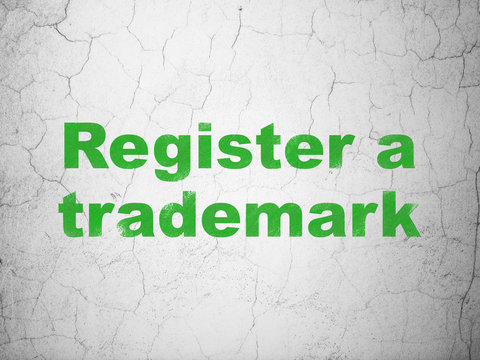 Law concept: Register A Trademark on wall background