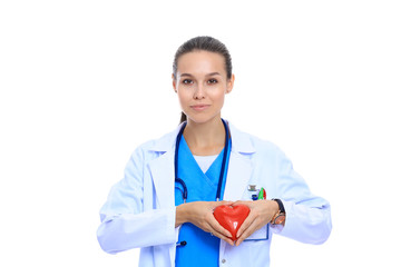 Fototapeta premium Positive female doctor standing with stethoscope and red heart symbol