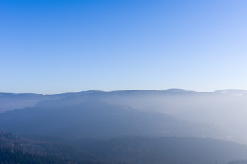 View from Yburg castle with fog in the valley and Mehliskopf on right side