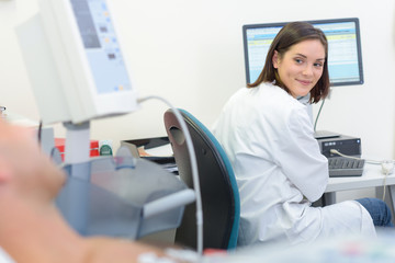 Nurse turning to smile at patient