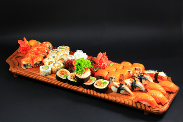 Big Sushi set on wood board.