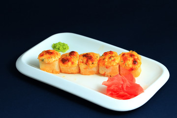 Sushi rolls on white plate.