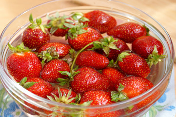 Fresh strawberry in capacity with water