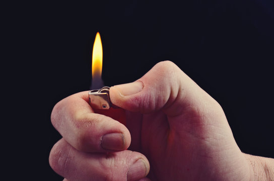 the hand with the lighter