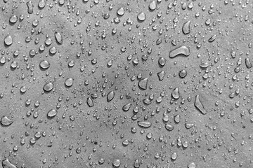 Large water drops on dark fabric