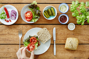 foodie preparing a fresh organic sandwich