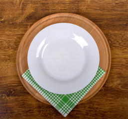 plate with napkin at cutting board 