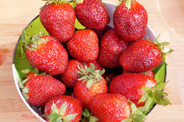Bright fresh strawberry in a round container