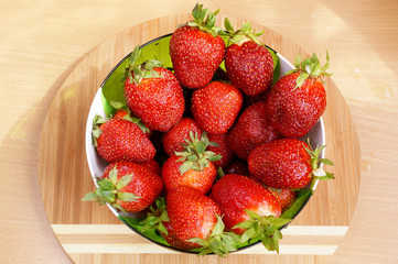 Bright fresh strawberry in a round container