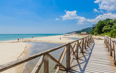 Wooden footbridge over the river. Black Sea Coast,  seaside resort Albena, Bulgaria - obrazy, fototapety, plakaty