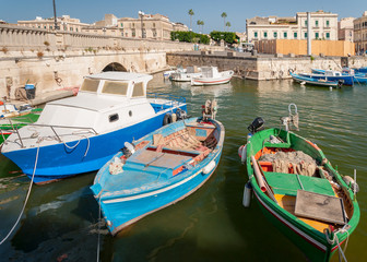 Fototapeta na wymiar Fishing boats in the city of Syracuse, Sicily