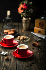 Cup of coffee and makaroons, coffee beans and sugar