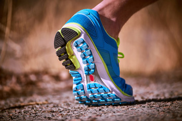 Running athlete during training outdoors in the summer on a sunny day.