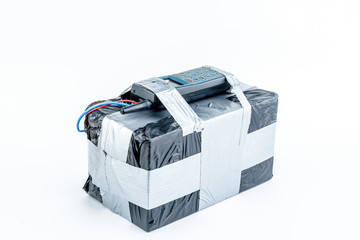 adio-controlled bomb with lcd screen, cell phone and colored wires on a white background. Concept image of terrorism, Explosion