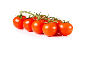 Red cherry tomatoes isolated on white background