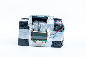 adio-controlled bomb with lcd screen, cell phone and colored wires on a white background. Concept image of terrorism, Explosion