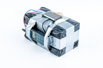 adio-controlled bomb with lcd screen, cell phone and colored wires on a white background. Concept image of terrorism, Explosion
