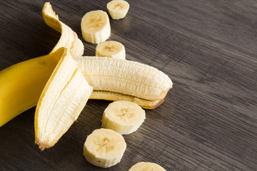 Banana on the wooden table in the kitchen. Healthy eating and lifestyle.