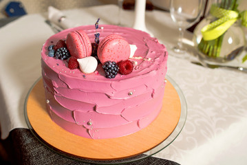 Sweet dessert- cake with berries and macaroons
