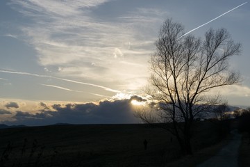 Naklejka na ściany i meble Sunset and sunrise with dramatic colorful clouds. Slovakia